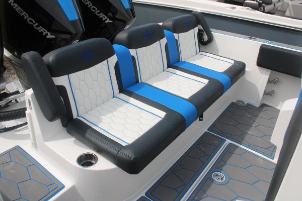 Slide: The Image of 2024 Fountain 34 SC boat seating with blue and white upholstery. - 22