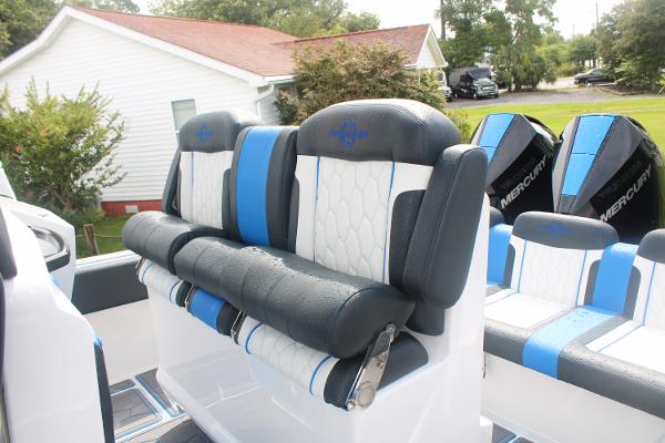 Slide: The Image of 2024 Fountain 34 SC boat seats with blue and white upholstery. - 23