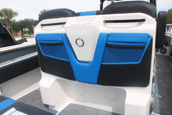 Slide: The Image of 2024 Fountain 34 SC boat interior with blue and black seating. - 26