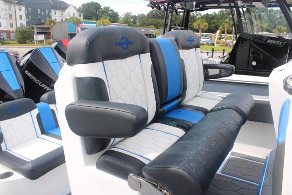 Slide: The Image of 2024 Fountain 34 SC boat with luxurious seating and Mercury engines. - 27