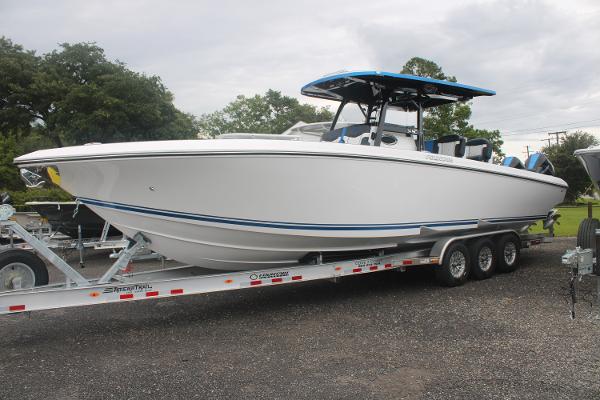Slide: The Image of 2024 Fountain 34 SC boat on a trailer, side view. - 3