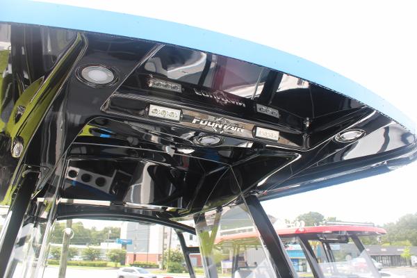 Slide: The Image of 2024 Fountain 34 SC boat's sleek black canopy with integrated lighting. - 35