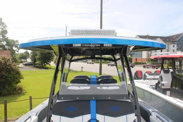 Slide: The Image of 2024 Fountain 34 SC boat with blue accents and modern design. - 36