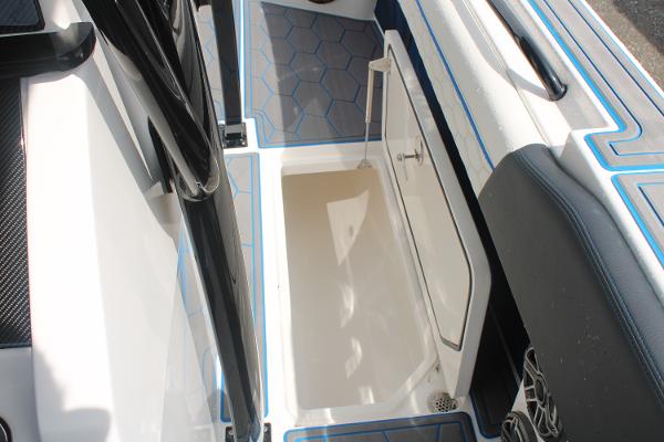 Slide: The Image of 2024 Fountain 34 SC boat storage compartment with hexagonal floor design. - 46