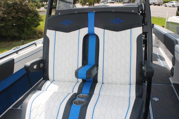 Slide: The Image of 2024 Fountain 34 SC boat seats with blue and white upholstery. - 48