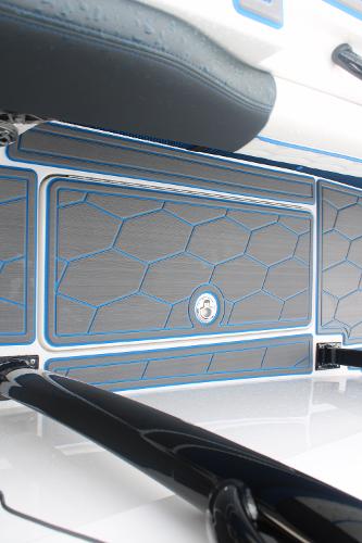Slide: The Image of 2024 Fountain 34 SC boat interior with hexagonal pattern flooring. - 49