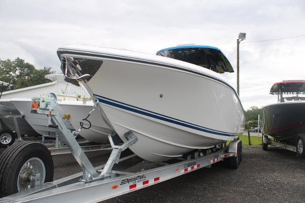 Slide: The Image of 2024 Fountain 34 SC boat on trailer, side view. - 7