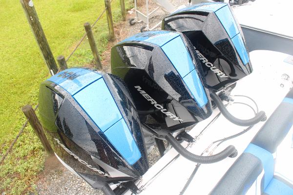 Slide: The Image of Triple Mercury outboard engines on a 2024 Fountain 34 SC boat. - 9