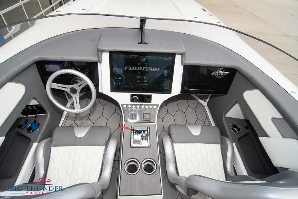 Slide: The Image of 2023 Fountain 34 Thunder Cat cockpit with modern controls and dual seating. - 21