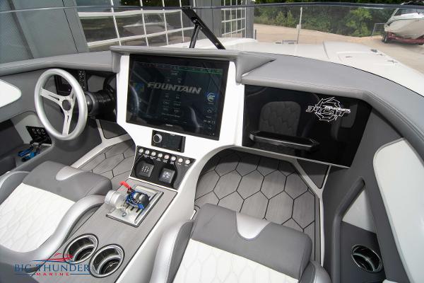 Slide: The Image of 2023 Fountain 34 Thunder Cat cockpit with modern controls and touchscreen display. - 23