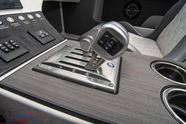 Slide: The Image of Control panel and throttle of 2023 Fountain 34 Thunder Cat boat. - 29