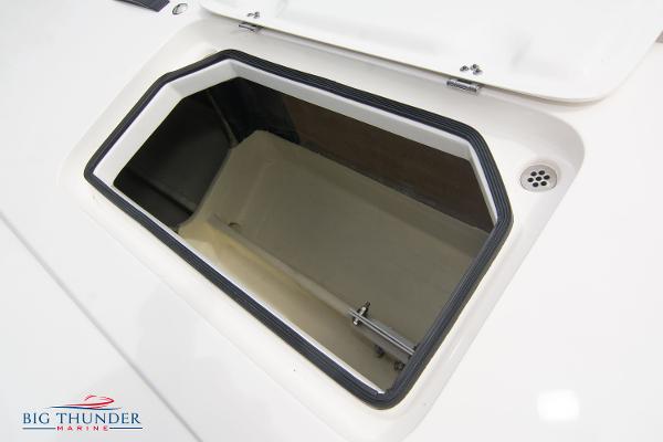 Slide: The Image of Open storage compartment on a 2023 Fountain 34 Thunder Cat boat. - 36