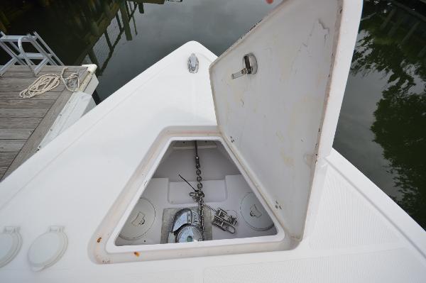 Slide: The Image of 2017 Fountain 38 Center Console anchor storage compartment with open hatch. - 15