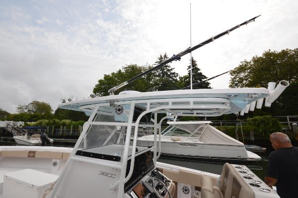 Slide: The Image of 2017 Fountain 38 Center Console boat docked, featuring a sleek design and advanced navigation equipment. - 30