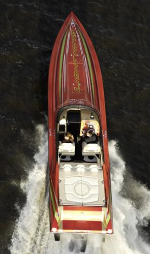 Slide: The Image of 2007 Fountain 38 Lightning speedboat on water, aerial view. - 2
