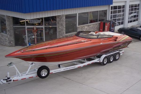 Slide: The Image of 2007 Fountain 38 Lightning speedboat on a trailer outside a marine dealership. - 7