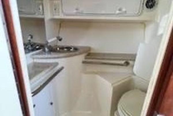Slide: The Image of 2005 Fountain 38 LX boat interior with sink and toilet. - 13