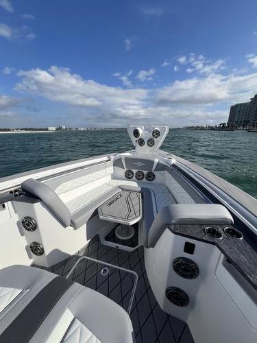 Slide: The Image of 2024 Fountain 38 SCX boat interior with seating and ocean view. - 20