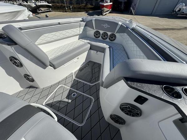 Slide: The Image of 2024 Fountain 38 SCX boat interior with luxurious seating and advanced audio system. - 22