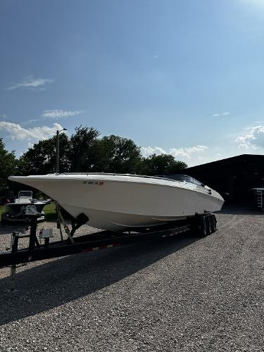 Slide: The Image of 2002 Fountain 42 Lightning speedboat on a trailer in a gravel lot. - 1