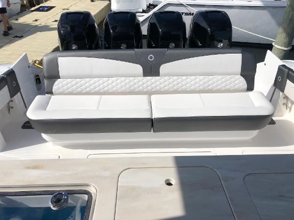 Slide: The Image of 2020 Fountain 43 NX boat with cushioned seating and multiple outboard engines. - 6