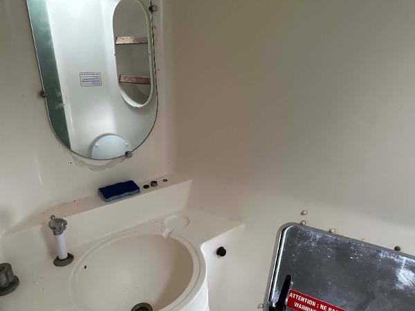 Slide: The Image of Bathroom interior of 1998 Fountaine Pajot Athena 38 catamaran with sink and mirror. - 19