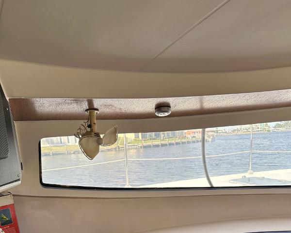 Slide: The Image of Interior view of 1998 Fountaine Pajot Athena 38 catamaran with window and fan. - 3