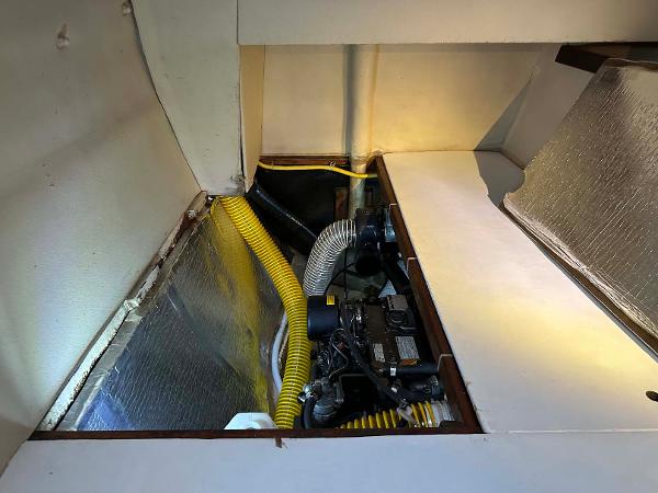 Slide: The Image of Engine compartment of 1998 Fountaine Pajot Athena 38 catamaran with yellow hoses and insulation. - 30