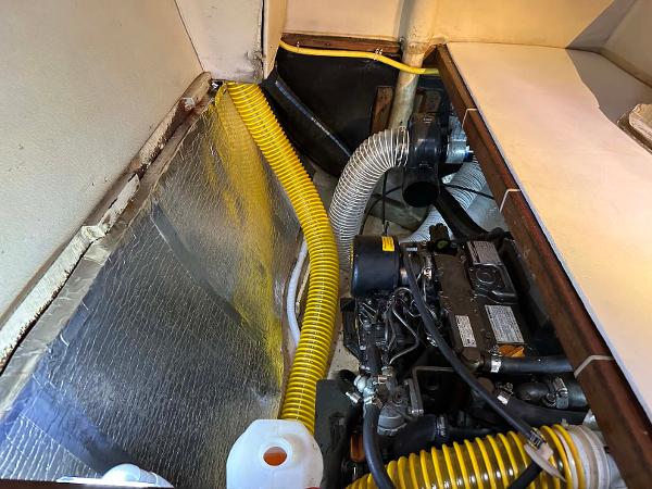 Slide: The Image of Engine compartment of 1998 Fountaine Pajot Athena 38 catamaran with visible hoses and insulation. - 31