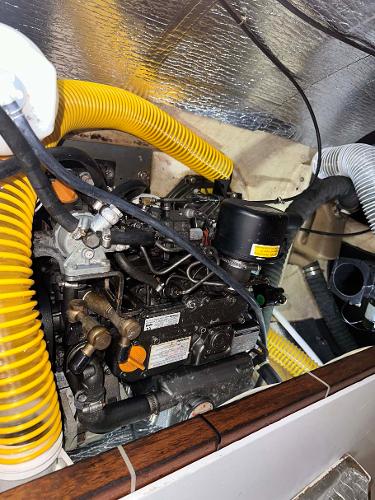 Slide: The Image of Engine compartment of 1998 Fountaine Pajot Athena 38 catamaran with yellow ventilation hoses. - 33