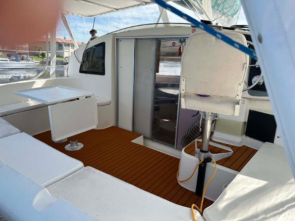 Slide: The Image of 1998 Fountaine Pajot Athena 38 catamaran interior with seating and table. - 35