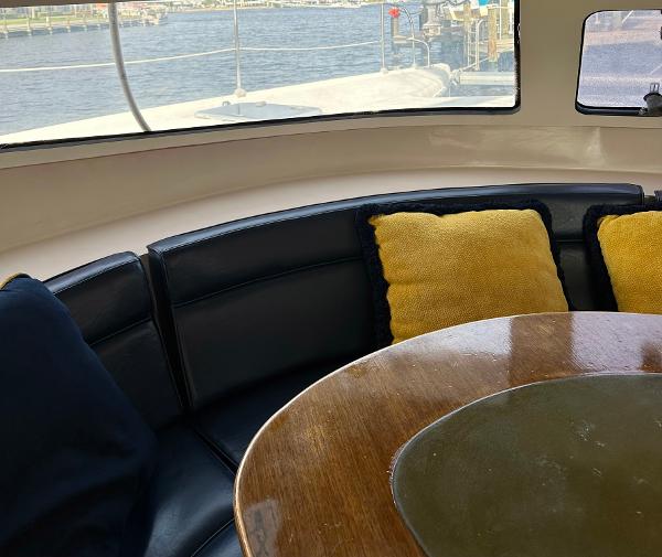 Slide: The Image of Interior of 1998 Fountaine Pajot Athena 38 yacht with cozy seating and cushions. - 4