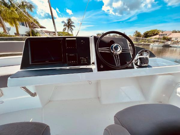Slide: The Image of Helm of 2015 Fountaine Pajot Cumberland 47 LC with steering wheel and navigation equipment. - 19