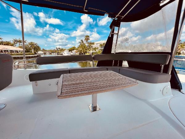 Slide: The Image of Spacious deck of 2015 Fountaine Pajot Cumberland 47 LC with seating and table. - 21
