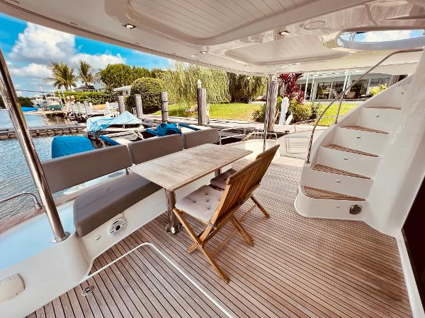 Slide: The Image of 2015 Fountaine Pajot Cumberland 47 LC yacht deck with seating and table. - 25