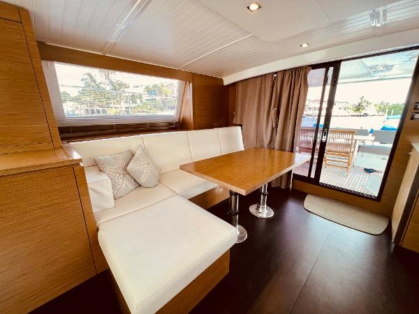 Slide: The Image of Interior of 2015 Fountaine Pajot Cumberland 47 LC yacht with elegant dining area. - 29