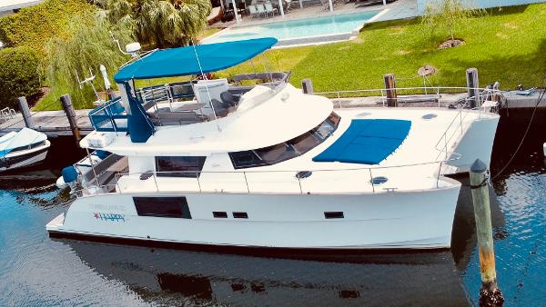 Slide: The Image of 2015 Fountaine Pajot Cumberland 47 LC yacht docked by a poolside. - 3