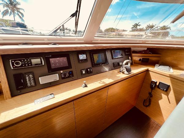 Slide: The Image of 2015 Fountaine Pajot Cumberland 47 LC yacht helm with navigation instruments and controls. - 35