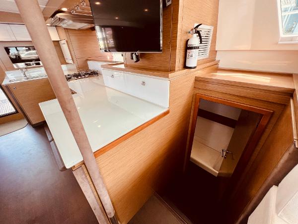 Slide: The Image of Interior of 2015 Fountaine Pajot Cumberland 47 LC yacht, featuring modern kitchen and staircase. - 37