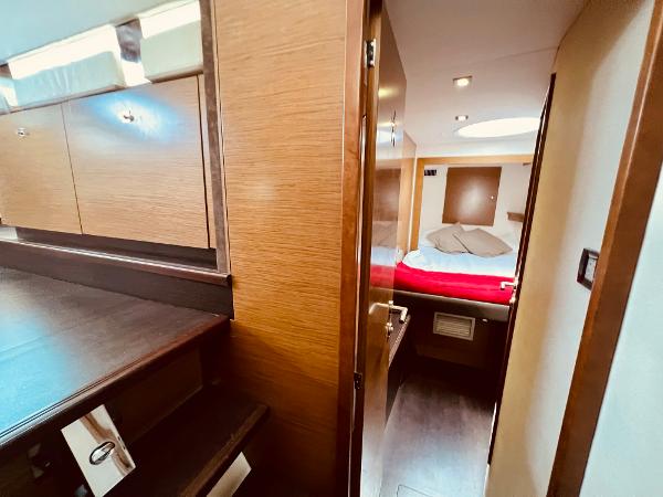 Slide: The Image of Interior of 2015 Fountaine Pajot Cumberland 47 LC yacht, featuring a cozy bedroom. - 40