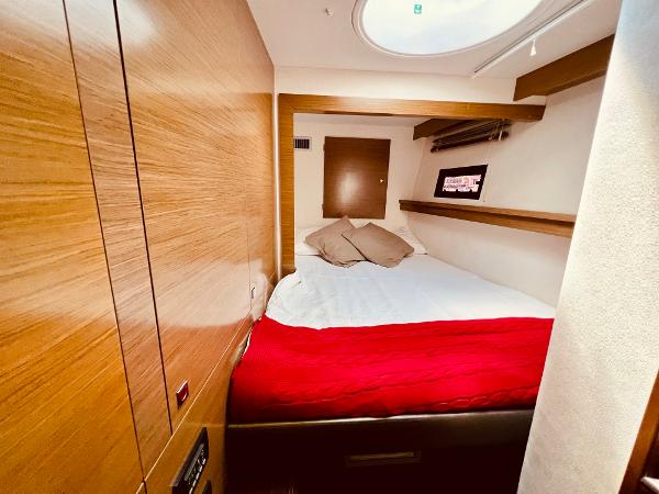 Slide: The Image of Cozy cabin interior of 2015 Fountaine Pajot Cumberland 47 LC with red bedding. - 42