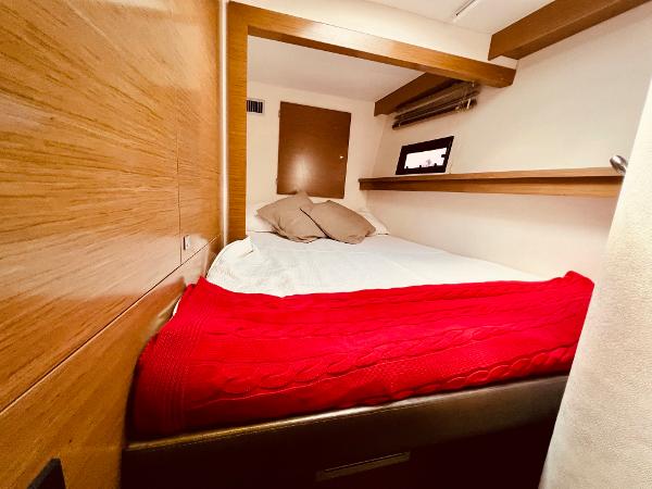 Slide: The Image of Cozy cabin interior of 2015 Fountaine Pajot Cumberland 47 LC with red blanket. - 43
