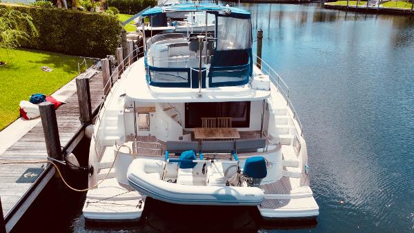Slide: The Image of 2015 Fountaine Pajot Cumberland 47 LC yacht docked in a serene marina. - 8
