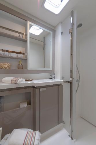 Slide: The Image of Modern bathroom in 2024 Fountaine Pajot Elba 45 catamaran with sleek design and ample storage. - 7