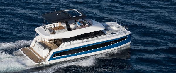 Slide: The Image of 2025 Fountaine Pajot MY 6 yacht cruising on open water. - 0