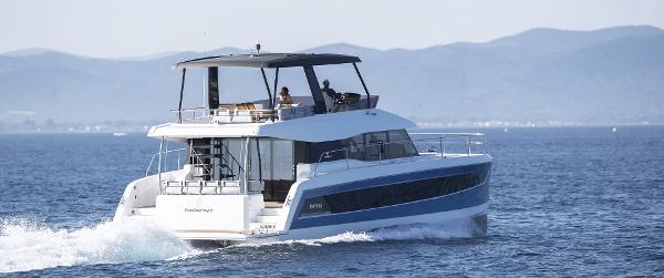 Slide: The Image of 2025 Fountaine Pajot MY 6 motor yacht cruising on open water. - 3