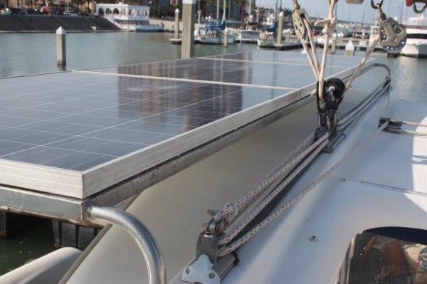 Slide: The Image of Solar panels on a 2008 Fountaine Pajot Orana 44 catamaran in a marina. - 16