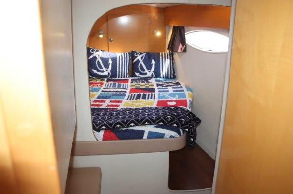 Slide: The Image of Cozy bedroom in 2008 Fountaine Pajot Orana 44 catamaran with nautical-themed bedding. - 31