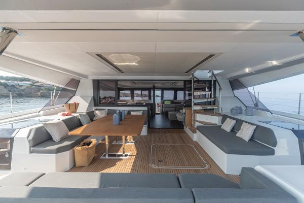 Slide: The Image of Spacious interior of 2024 Fountaine Pajot Samana 59 yacht with modern seating and dining area. - 0