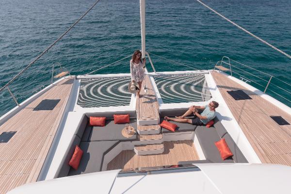 Slide: The Image of 2024 Fountaine Pajot Samana 59 yacht with people relaxing on deck. - 14